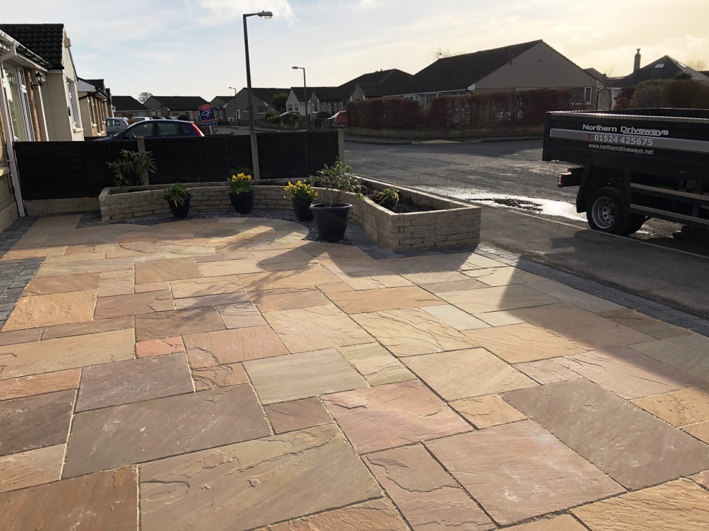 Indian Sandstone paving with charcoal borders and walls
